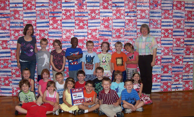 photo of: Kindergarten Collaborative Quilt Construction in Response to "Red, White and Blue" by Debbie Clement