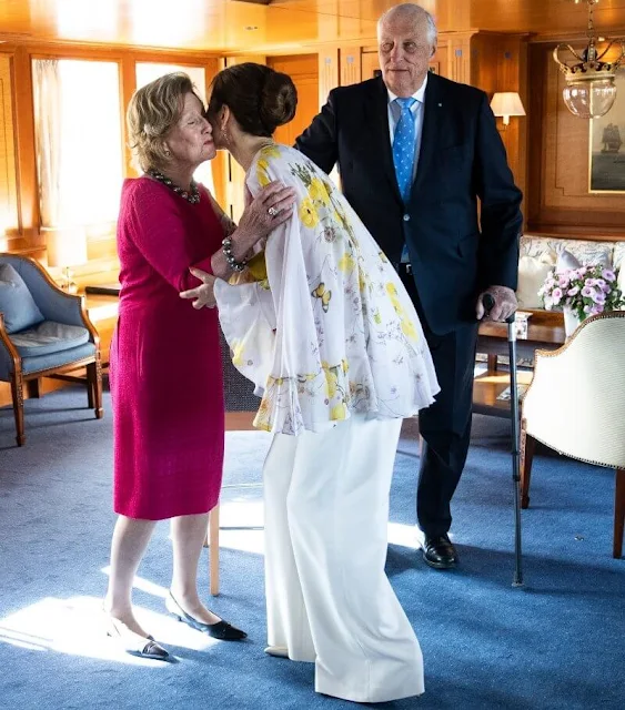 Crown Princess Mary wore a new cape-back floral-print silk-georgette blouse by Giambattista Valli. Rebekka Notkin