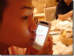 Pon Pon showing me the iPhone kissing app.