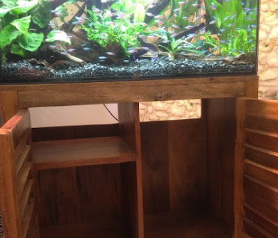 Furniture open at back for aquarium filter