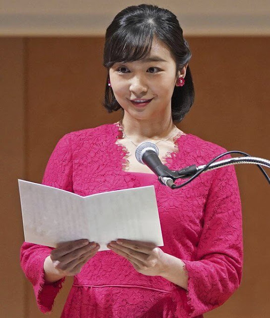 Princess Kako of Japan wore a fuchsia lace v-neck midi dress. gold necklace and red flower earrings. Red leather clutch bag