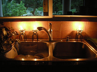 washing dishes by candlelight