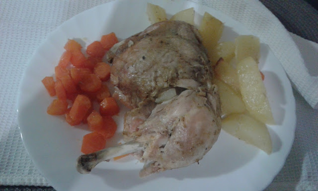 baked chicken with carrots and potatoes in oven