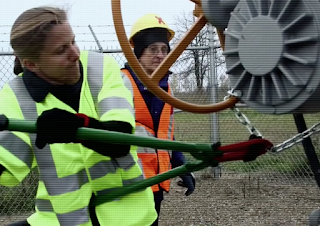 Emily Johnston and two other activists were charged with felonies for shutting down a pipeline in Minnesota. A fourth activist filmed it. A judge in their trial has allowed the defendants to use the "necessity" defense. (Credit: Direct Climate Action) Click to Enlarge.