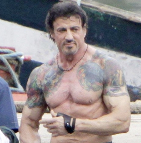 Mario Barth client Sylvester Stallone showed off his ink at the tattoo show.