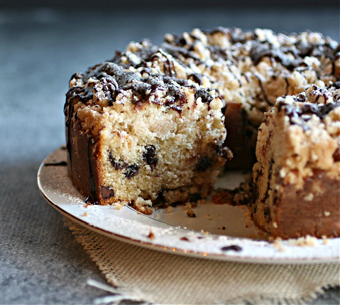 Recipe for a moist chocolate chip cake with a thick crumb topping and chocolate sauce.