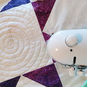 Modern Jacob's Ladder quilt using Island Batik fabrics and spiral walking foot quilting