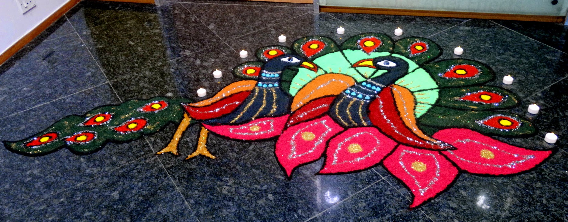 Rangoli is a traditional decorative folk art of India. And the importance of these designs are different in different states of the country. In fact, Rangoli designs are made in different states of India during different occasions & festivals. These are decorative designs made on floors of living rooms and courtyards during Hindu festivals and are meant as sacred welcoming areas for the Hindu deities. The ancient symbols have been passed on through the ages, from each generation to the one that followed, thus keeping both the art form and the tradition alive.