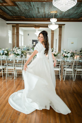 bride twirling dress in reception