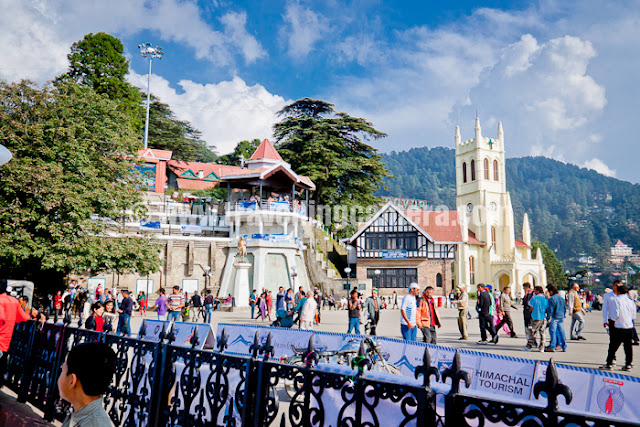 During recent trip to Shimla, I was travelling on bikes most of the time. Our bikes even hit the restricted regions like Mall Road, Ridge and Lakkar bazar... Let's have a quick Photo Journey of Shimla !!!New look of Gaiety Theatre in Shimla. This Theatre is situated on Mall Road and now open for all. There is small ticket amount one needs to pay to explore it inside. Various plays, exhibitions and other cultural events take place at Gaiety Theatre. Some part of Gaiety is also visible from Ridge.Afternoon view of Ridge, Shimla !!! Some Himachal Tourism activity was going and Aneesh was allowed to take his bike to Ridge with proper care. Ridge, Mall Road and Lakkar Bazar regions are restricted areas where vehicles are not allowed.Birds roaming around Ridge/Mall Road during Saturday Evening :) ... Saturday evenings are very popular for folks in Shimla and Mall road is too much crowded during Saturday evenings. Bird watching could be one of the reasons..A view of Shimla from High Court building. This photograph is clicked from Mall Road only, but near High Court of Himachal Pradesh !!!I am completely in love with Shimla Architecture and my camera couldn't resist clicking all those building on Shimla streets & roads. This photograph was clicked while we were climbing up towards Mall Road from HHH hotel.More beautiful buildings from Shimla, but increasing vehicles are becoming one of the main challenges when parking is biggest issue in the city. But it's amazing to these folks driving so fast on narrow roads with lots of curves here and thereHere comes Mr. Aneesh Awasthi. Here he is trying typical short cuts in Shimla, but mostly they are for walking people not for bikers. Since it's difficult for Aneesh to walk, so he thought of riding down these stairs.During noon there is nothing on Mall road so came down towards Shimla Market and thought of going towards Naldera Golf ground... Although plans changed later. I hope you noticed the density of houses on these hills. There is no difference between these hill stations and metros like Delhi now.Here is a view of Mall road after sunset. Folks have started coming to Mall Road and soon it will be fully loaded, or in fact overloaded.Here is another view of Ridge in Shimla. Ridge and Mall road are well connected with each other and have many decent restuarants around the place. Ridge is basically a huge tank of water which is main supply for various parts of Shimla. There is also an underground makrket called Indira Market and Press Club of Shimla is also situated in this market.Wonderful view of Christ Church on Ridge, Shimla. Bright blue sky make this photograph more intersting... This was a qick photo journey with no plans and thought of sharing here... Hope to be there in Shimla for Christmas and wish to click some the same places with snow !!!
