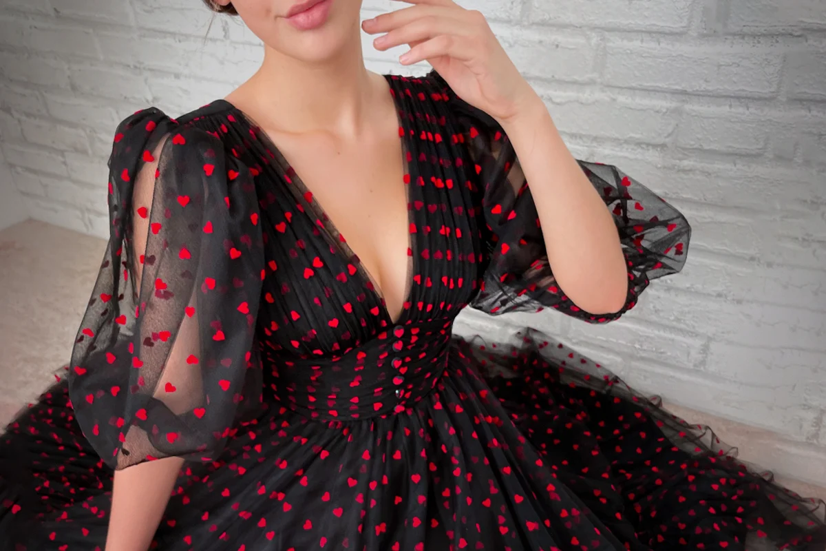 close-up image of a black and red tulle cocktail dres