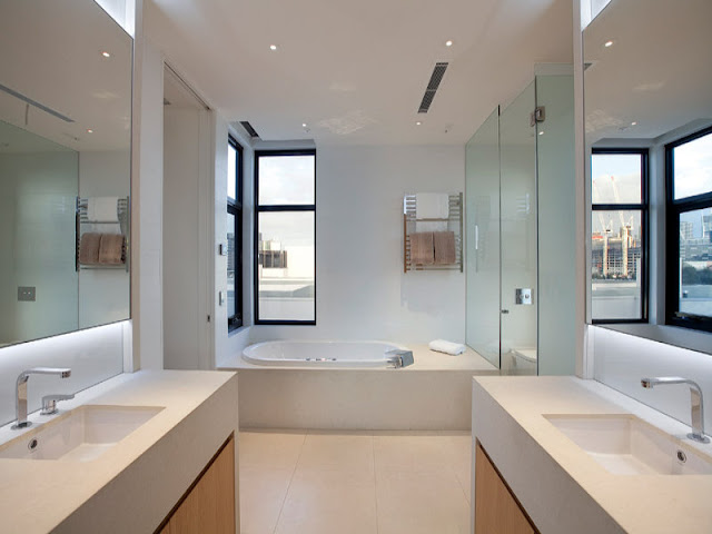 Photo of modern bathroom interiors as seen from the entrance