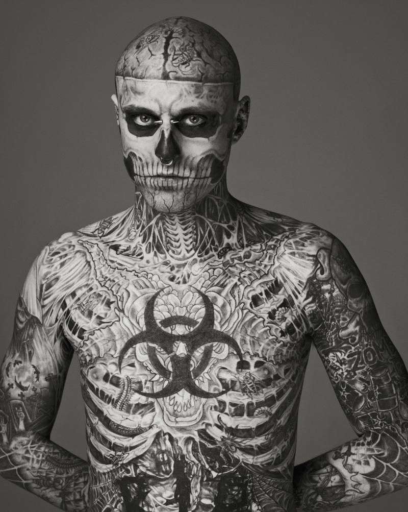 Genest is tattooed entirely