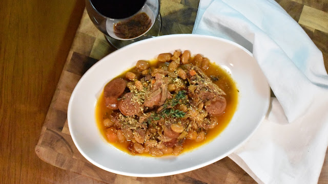 Streamlined Cassoulet with a glass of wine.
