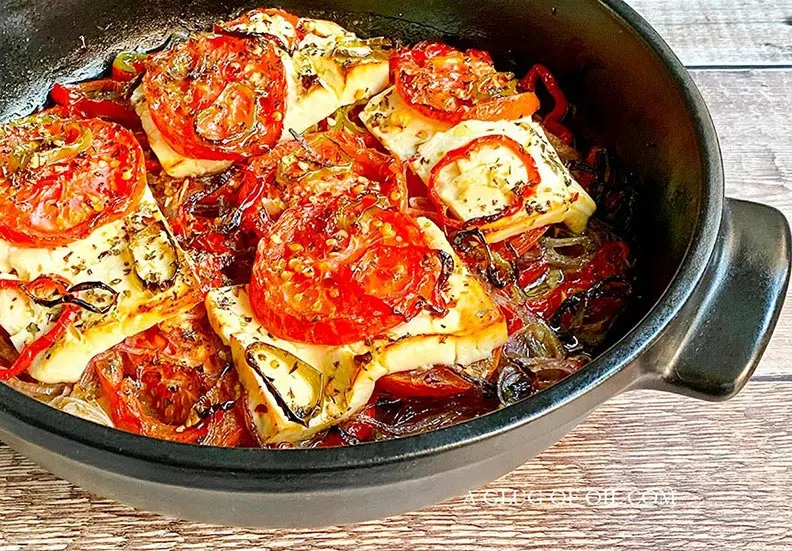 Baked feta with tomatoes, onions and peppers.