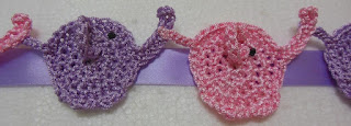 Sweet Nothings Crochet free crochet pattern blog, photo of the set of elephants strung onto a satin ribbon