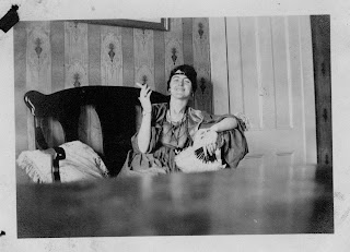 Mary Connelly in a play costume in living room at 50 Cedar St, Cambridge, MA-1918