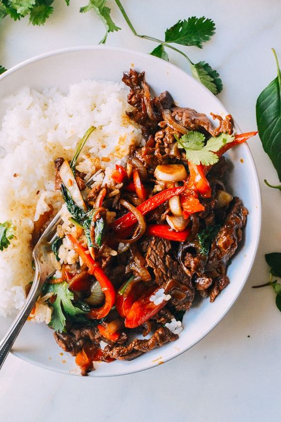 Thai Basil Beef, or Pad Gra Prow, is an easy, delicious dish of stir-fried beef and thai basil. Thai Basil Beef over white rice is a perfect 15-minute meal.