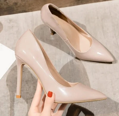 A pair of Nude Pointed Toe Heels