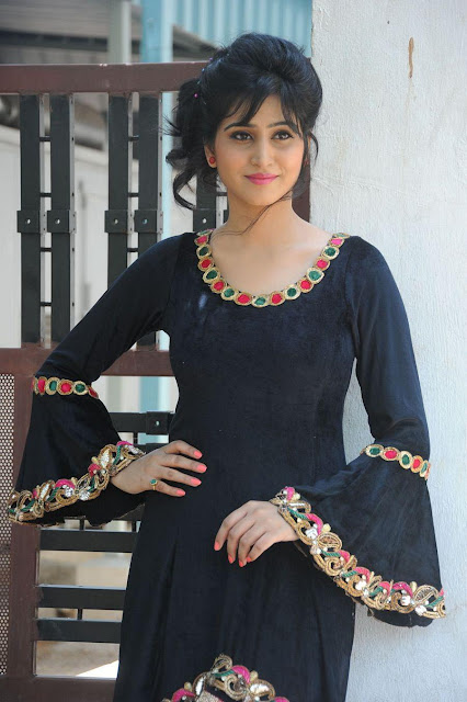 Varshini Sounderajan looking chic in a black outfit, a picture of elegance.