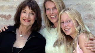 Member of Serbia's royal family Princess Jelisaveta Karadjordjevic (L) poses for a picture with her daughter U.S. actress Catherine Oxenberg (C) and grand daughter India (R) at her home in Belgrade's suburb of Zemun June 11, 2004.