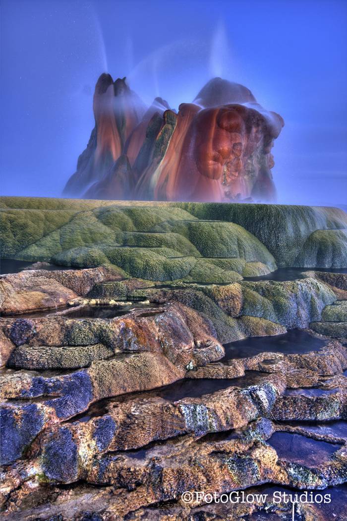 Fly Geyser is a little-known tourist attraction, even to Nevada residents. It is located near the edge of Fly Reservoir and is only about 5 feet (1.5 m) high, (12 feet (3.7 m) counting the mound on which it sits). The Geyser is not an entirely natural phenomenon, and was accidentally created in 1916 during well drilling. The well functioned normally for several decades, but in the 1960s geothermally heated water found a weak spot in the wall and began escaping to the surface. Dissolved minerals started rising and accumulating, creating the mount on which the geyser sits, which continues growing. Today water is constantly spewing, reaching 5 feet (1.5 m) in the air. The geyser contains several terraces discharging water into 30 to 40 pools over an area of 30 hectares (74 acres). The geyser is made up of a series of different minerals, which gives it its magnificent coloration.