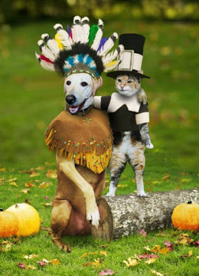 Cabana's head stuck into a photo of a dog dressed as an Indian, next to a cat dressed as a pilgrim