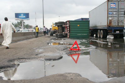 POTHOLES-FILLED ROADS, ADDS TO COST OF DOING BUSINESS IN NIGERIA.