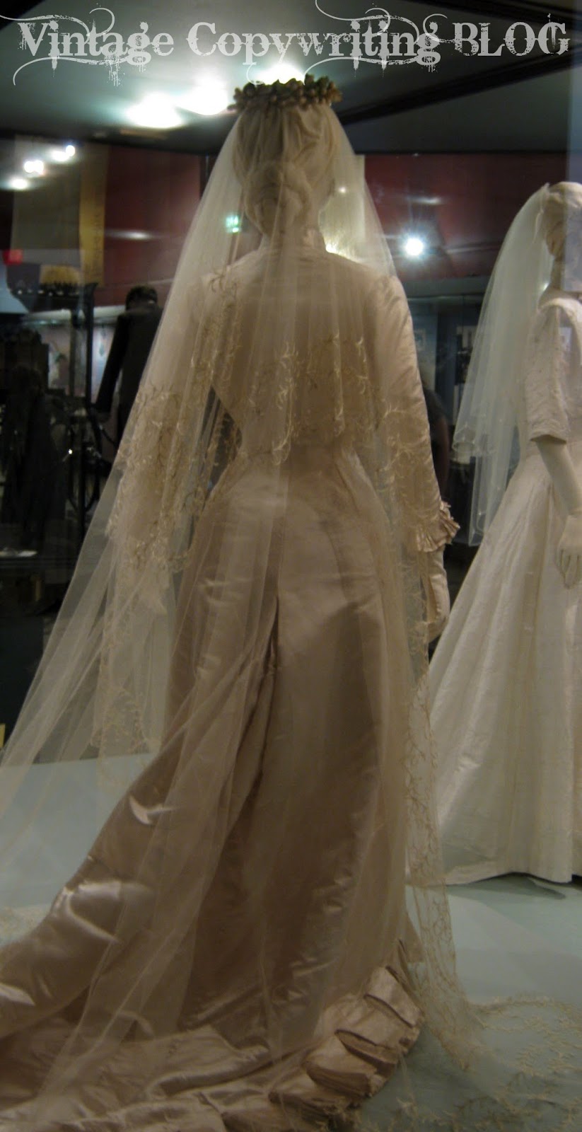 The dress is cream satin