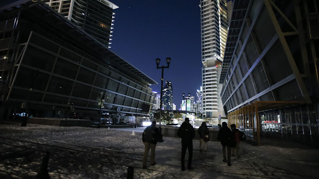 Nearby buildings are dark, but a few blocks over the lights remained on in downtown Dallas.