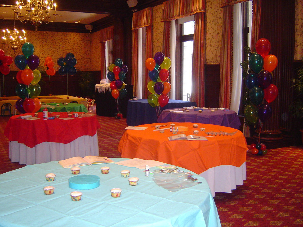 The long banquet tables in the decorating table