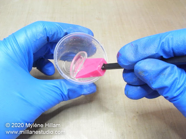 Removing a silicone stirrer standing in a cup of cured resin