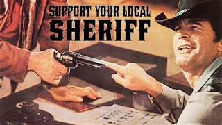 Support Your Local Sheriff movie title with image of James Garner with his finger in the barrel of a pistol.