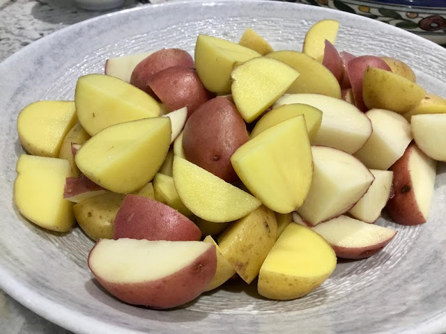 bowl of quartered potatoes