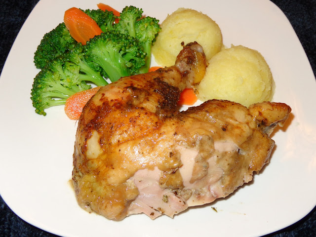 PORTIONS: 4 INGREDIENTS 4 lb. whole chicken 2 cups water or chicken broth 1 cup white wine ½ cube chicken bouillon, without monosodium glutamate 2 tsp. cornstarch TARRAGON PASTE SEASONING 1/4 cup chopped onions 3 garlic cloves, chopped ⅓ cup fresh tarragon leaves, chopped ¼ cup slivered almonds 1½ tsp. salt 1 tsp. paprika ¼ tsp ground black pepper 1 tbsp. soften butter 3 tbsp. olive oil 1lemon, juice METHOD Make the tarragon paste placing all the ingredients in a blender. Lately it is recommended not to wash the chicken, for the risk of contamination when the water splashes on other surfaces. I’m sorry, but I rinse the chicken inside and out, with cold water. Pat dry the chicken with paper towels and place it in a dish temporarily. Then clean with soap and water the entire area of the sink or surfaces that may have been contaminated. With your fingers, separate the skin from the breast and thighs without tearing it apart. Using a teaspoon spread the ½ tarragon paste underneath the skin, around the breast and thighs.  Spread the rest of the tarragon paste over the chicken skin. Bend the wings under the chicken and tight the chicken legs with a kitchen twine. Pour the water and wine in a pot. Bring it to a boil and dissolve the chicken bouillon. Place the liquid in a roasting pan and put a griddle on top. Place the chicken on top of the griddle. Preheat the oven at 325°F / 163°C Roast the chicken for about 2 hours. Baste the chicken every 20 minutes. The chicken should have a minimal internal temperature of 165°F / 74°C or if you pierce it with a skewer the juices should run clear, cook until golden brown. Pour the juices in a fat separator discard as much fat as possible. Pour the liquid in a pot and bring it to a boil. Mix the cornstarch with 1 tbsp. of water and mix it into the liquid. Let the sauce cook for 3 minutes.  Untie the legs, carve the chicken and serve with the sauce o natural juices.