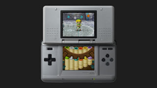 an old Nintendo DS against a black background with a Spirit Flute play on the screens