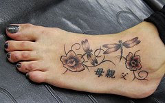 flowers on foot tattoo