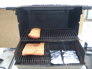 My barbeque set-up for smoking: wood chip packets on one side with heat on, meat on the other side with heat off