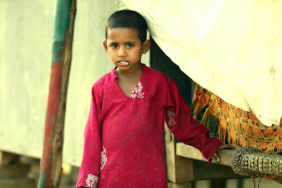 kid standing in front of wall