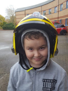 Dan Jon wearing a Fire Helmet