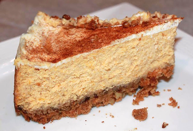 this is a slice of Amaretto Cheesecake that has pumpkin puree in the filling with a cracker sweet cinnamon crust