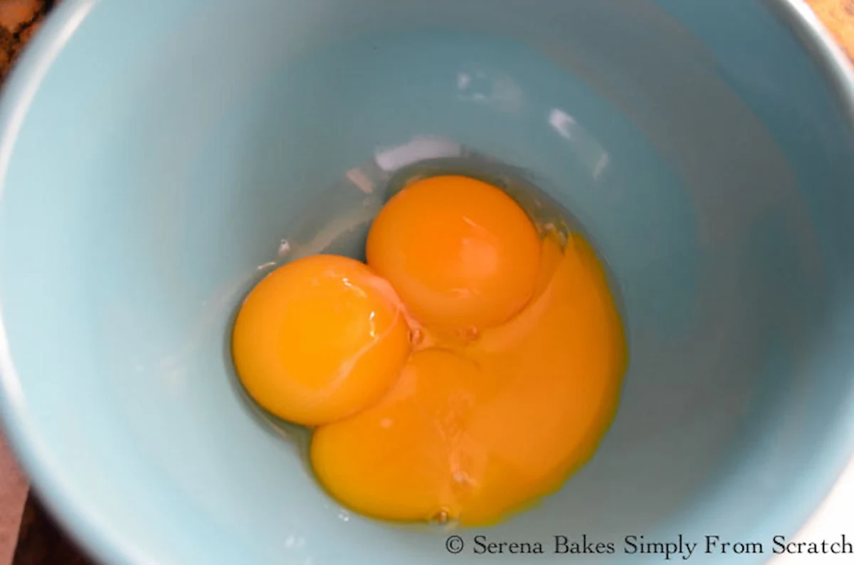 3 whole Egg Yolks in a small blue bowl.