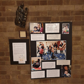 A display panel with photos of the Challenge Group which welcomes young children with additional needs.