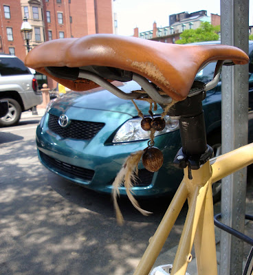 Wooden Beads and Feathers on a bike