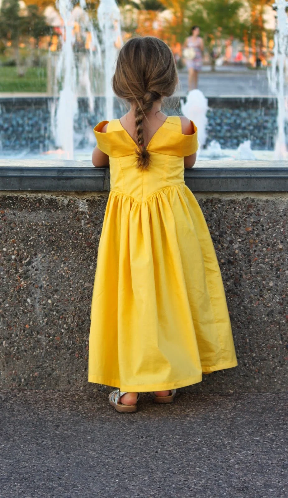 Little girl in yellow princess party dress