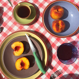 Fresh Peaches on Breakfast Table in Tuscany on Red Gingham Tablecloth