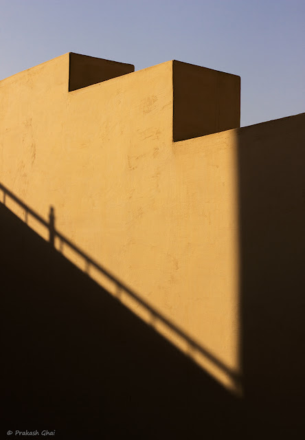 A Minimalist Photograph of the Edges of a Wall at Jantar Mantar, Jaipur with the Shadow of railing falling on it.