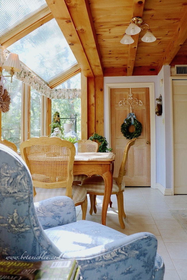 A French Country inspired conservatory attached to our kitchen serves as a sun parlor.