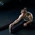 Man sitting on the floor and stretching