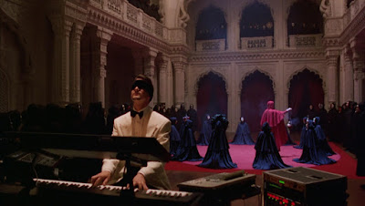 Nick Nightingale plays the piano blindefolded at a secret gathering, Directed by Stanley Kubrick
